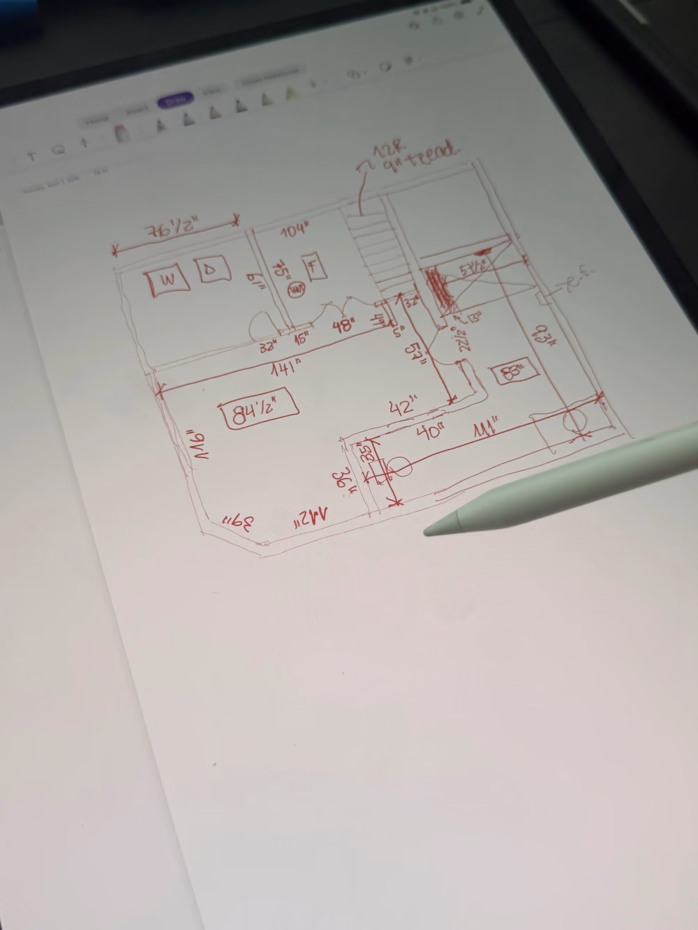 Residential floor plans being reviewed around a table